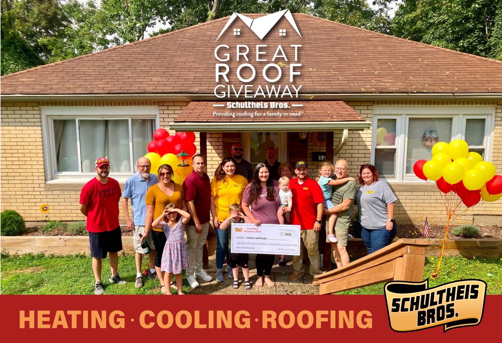 Great Roof Giveaway winners in front of their house